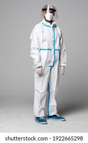 Man In A Hazmat Protective Equipment With A Mask And Face Shiled Isolated On White Background