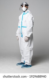 Man In A Hazmat Protective Equipment With A Mask And Face Shiled Isolated On White Background