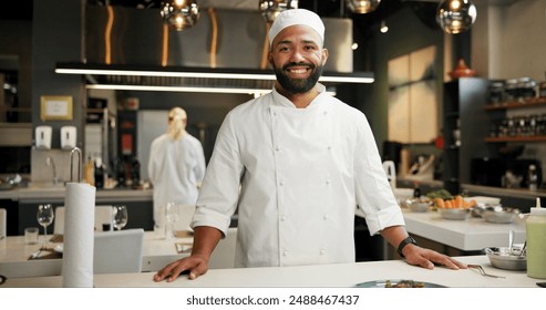 Man, head chef and portrait in kitchen for business, happy and smile in food restaurant with confidence. Culinary skills, hospitality industry and professional gastronomy, cook and service staff - Powered by Shutterstock