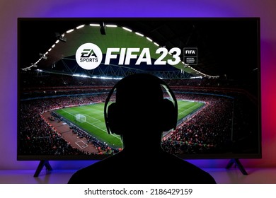 Man With Headphone Play FIFA 23 At TV Screen, 4 Aug, 2022, Sao Paulo, Brazil.