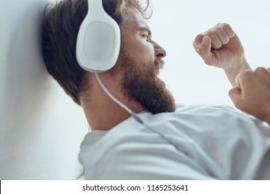 man in headphones side view                           - Shutterstock ID 1165253641