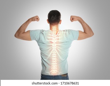 Man and healthy back light background  Spine pain prevention