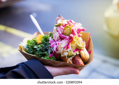 Man With Healthy Vegan Street Food From New York  In His Right Hand