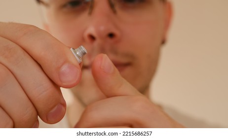 Man With Herpes On Lips Against Light Grey Background. Cold Sore On A Man Lips. Sore Virus Concept. Man Touch Sore By Fingers And Use Cream For Treatment And Therapy Sore. Man Spread White Cream 