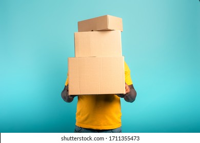 Man Is Hidden By Too Many Received Packages. Cyan Background