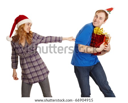 The man hides all Christmas gifts from the woman isolated on a white background