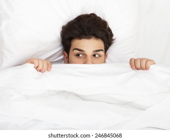 Man Hiding In Bed Under The Sheets