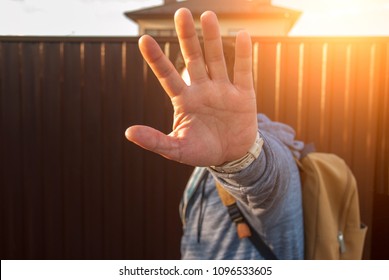  Man hiding his face from camera because of privacy GDPR on summer sunset . - Powered by Shutterstock