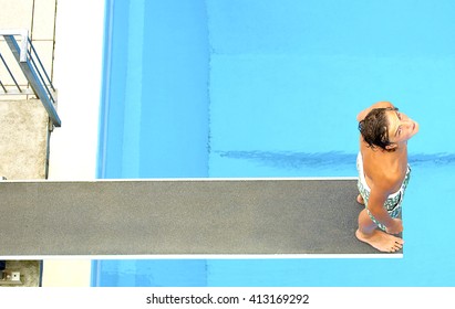 Man At High diving board at a public swimming pool