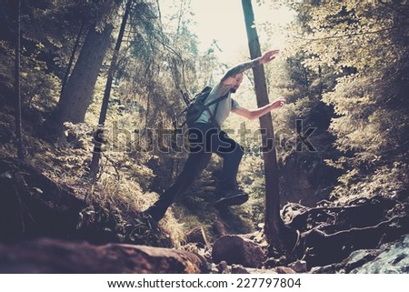 Similar – Woman walking on a fallen tree trunk