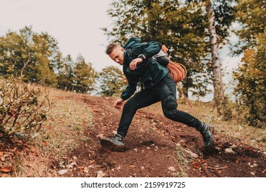 A man hiker trail hiking in the mountain forest. People adventure travel. Extreme sport outdoor.