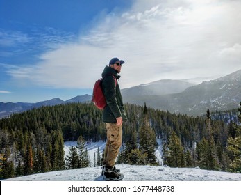 A man hiking around the Rocky Mountain park in Colorado,