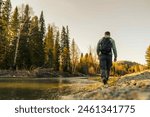 man hiking in the autumn forest 