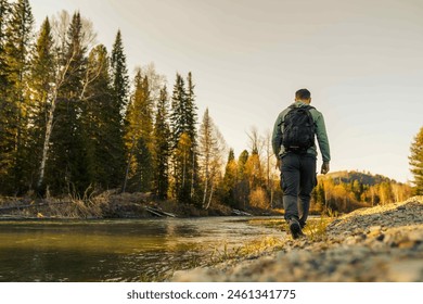 man hiking in the autumn forest  - Powered by Shutterstock