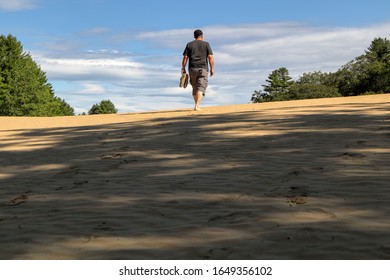 A Man Hiking In The Beautiful Desert Of Maine Park Near Freeport, Maine