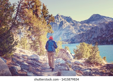 Man With Hiking Equipment Walking In Sierra Nevada Mountains, California, USA