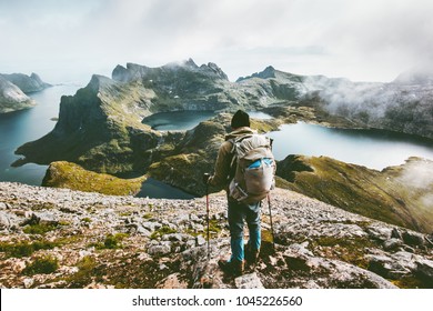 Man hiking in mountains enjoying Norway landscape Travel adventure healthy lifestyle concept active backpacking wanderlust summer vacations outdoor 