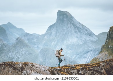 Man hiking in mountains traveling solo with backpack outdoor active vacations in Norway healthy lifestyle extreme sports - Shutterstock ID 2159633001