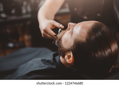 Man hipster having barber shave barbershop.