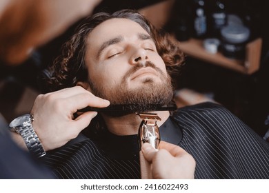 Man hipster having barber shave barbershop hair machine. - Powered by Shutterstock