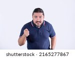 A man in his 30s reprimanding someone, pointing with his finger. Isolated on white background. Front view.