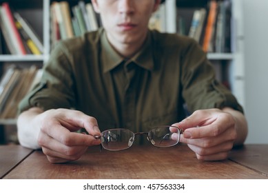 Man With His Broken Eyeglasses