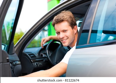 Man In His Car Stops At Petrol Station