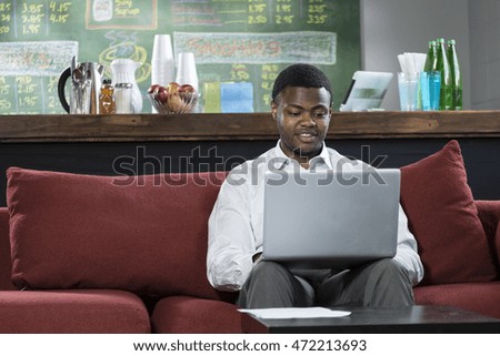 Man at his computer smiling