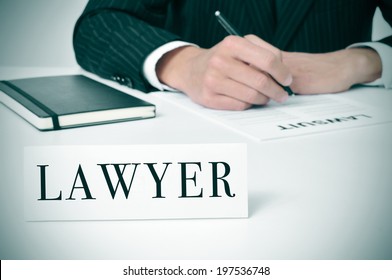 A Man In His Desk With A Nameplate In Front Of Him With The Word Lawyer Written In It