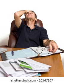 Man At His Desk Paying Bills, Too Many Bills.