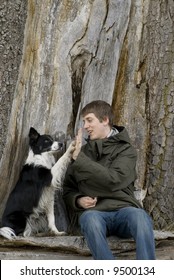 Man With His Dog Doing High Five