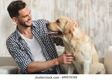 Man And His Dog Looking At Each Other