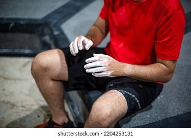 Man With His Hands Covered With White Magnesium Powder