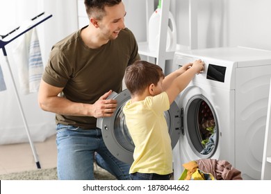 Man and his little son doing laundry at home - Powered by Shutterstock