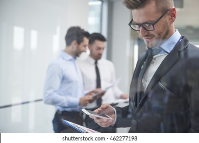 Man and his team behind the glass - Shutterstock ID 462277198