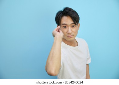 A Man In His Twenties In Front Of Throwing Darts