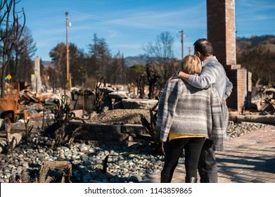 Man and his wife owners, checking burned and ruined of their house and yard after fire, consequences of fire disaster accident. Ruins after fire disaster. - Shutterstock ID 1143859865