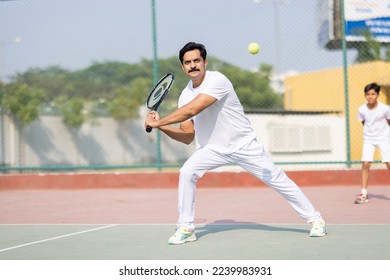 A Man hitting a great tennis shot - Powered by Shutterstock