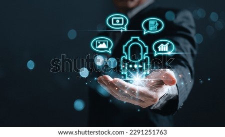 man hold bot icon and command prompt chatgpt ability to create photos,compose song and novels,make videos,stock trading,ai disruption in many professions.Digital Artificial Intelligence(AI) technology
