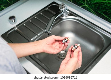 Man Hold Cartridge Or Mixer Of The Faucet, Plumber Repairing The Faucet Of A Sink In Kitchen, Repair And Fixing Leaky Old Faucet, Concept Of Repair And Technical Assistance