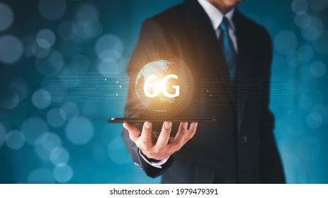 Man hold globe 6G with a electronic circuit pattern Virtual screen popped up. It consists of a 5G network to communicate technology around the world. Wireless connection concept new innovative concept