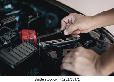 A Man Hold And Open Cap Of Add Battery For Add Distilled : Maintenance And Inspections For Extended Service Life Battery Of Car