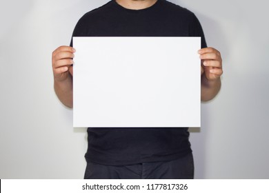 Man Holding A A3 Paper