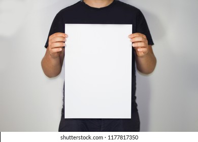 Man Holding A A3 Paper