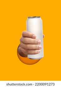 Man Holding Aluminum Can On Yellow Background