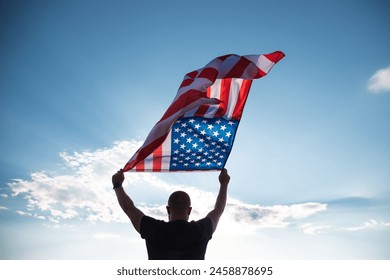 Man holding american USA flag. Independence Day or traveling in America concept.  - Powered by Shutterstock