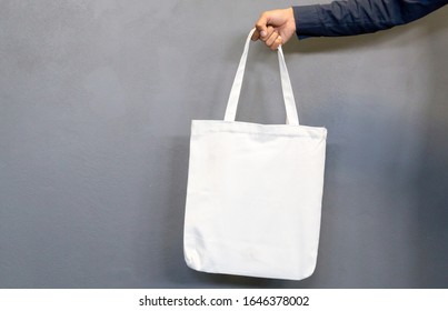 Man Holding Bag Canvas Fabric For Mockup,ecology Concept.