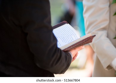 Man Holding A Bible 