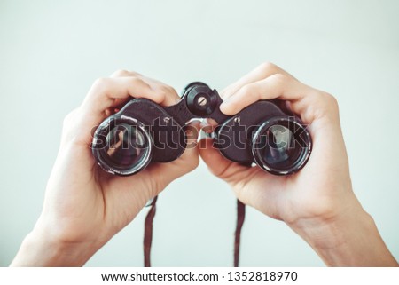 man holding binoculars