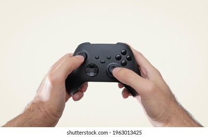 Man Holding Black Next Gen Game Controller